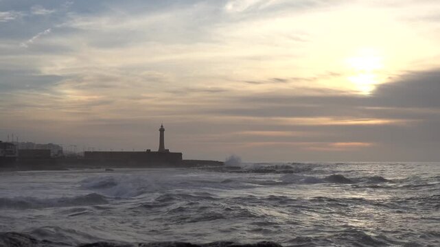 Rabat, Morocco Large waves on the Atlantic Ocean roll past the Lighthouse of Rabat. 