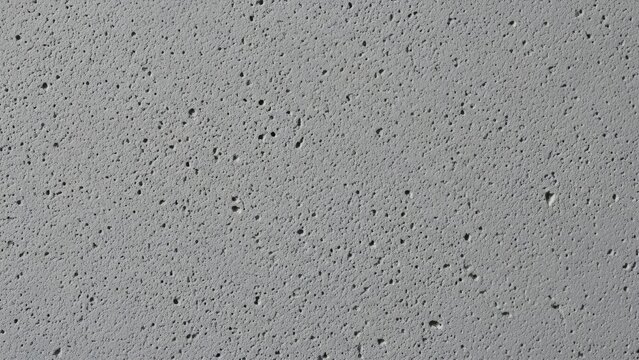Subtle Pockmarked Grey Concrete Surface Texture Background