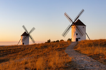 Naklejka premium Traditional windmills standing at sunset in Mota del Cuervo Spain
