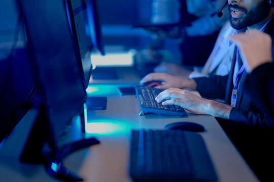 AI squad deep focus late night. Diverse male and female engineers train complex machine learning model, analyze intricate datasets, code screens glow bright innovation lab future tech build mode on.