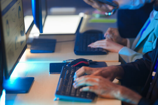 Cyber defenders race against time hands fly keyboard analyze threat data respond instantly command center active intense vigilance protects network now secure future build shield up protect now.