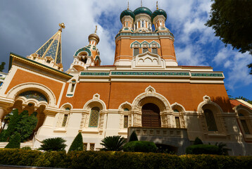 Daytime view of St. Nicholas Orthodox Cathedral in Nice, France, . Stunning Russian Revival architecture surrounded by trees, captured in natural daylight .