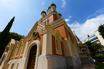 Daytime view of St. Nicholas Orthodox Cathedral in Nice, France, . Stunning Russian Revival architecture surrounded by trees, captured in natural daylight .