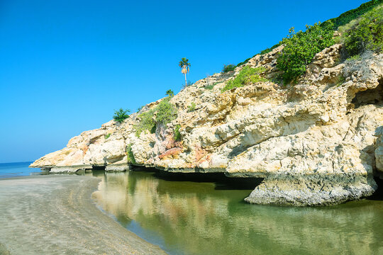 Beautiful gypsum cape, pushes out into the sea. Calcifilous plants. Gulf of Oman