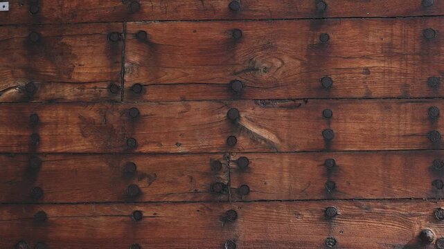 Construction of a wooden ship. Shipyard of traditional Dhow wooden boat on Iranian Qeshm Island. Board of Tradition Lenz Fishing Boat in Southern Iran. Old wooden stealth smuggler's ship.