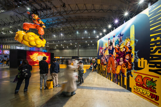 chiba, makuhari - jan 25 2026: A giant Japanese Goku inflatable on a Nimbus and a fortieth anniversary mural are shown at the free Dragon Ball Genkidamatsuri event inside the Makuhari Messe hall.