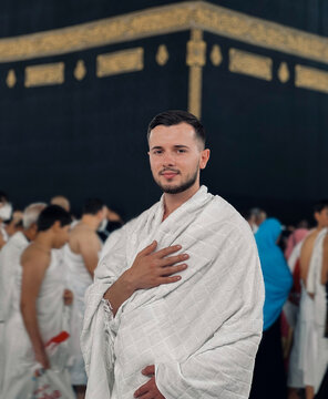 Muslim Man in Ihram Praying at Kaaba in Mecca During Hajj Pilgrimage Islamic Religious Tradition and Spirituality Saudi Arabia.