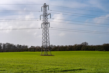 Electric pylon in an arable agricultural field in the countryside