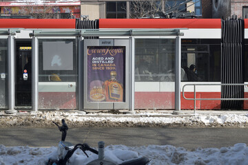 Obraz premium streetcar shelter on Spadina Av with alcohol advertisement, Toronto