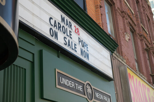 close-up of marquee sign with text (Mar 28, Carole Pope, On Sale Now) at El Mocambo, 464 Spadina Av, Toronto