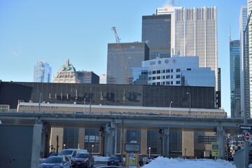 Naklejka premium looking north from Harbour St west of Bay St to elevated Gardiner Expressway, Scotiabank Arena, and towers in the financial district, Toronto