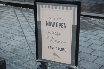 Obraz premium pavement sign outside Oretta, a restaurant, located at 160 Front St W, Toronto