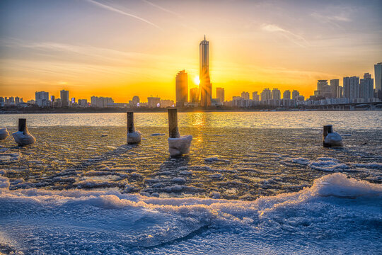 A winter sunset view from the Sunset 63 building on the frozen Han River in Seoul, South Korea.