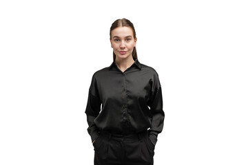Fototapeta premium Woman in a black shirt stands confidently with hands in pockets against a plain background