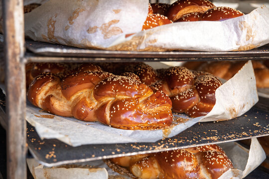 Freshly baked Challah bread lies on the shelves in the store eaten on the Jewish Shabbath
