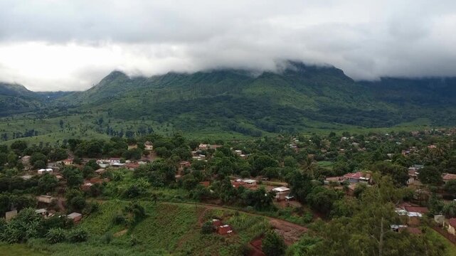 Aerial View of Mountain Villages and Mount Namuli Cloud-Covered Peaks in Gur&uacute;&egrave;, Zamb&eacute;zia, Mozambique