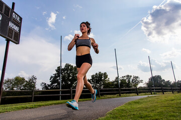Female Athlete Works Out Outdoors, Embracing Strength, Focus, and Natural Energy