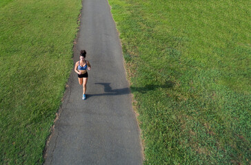 Female Athlete Works Out Outdoors, Embracing Strength, Focus, and Natural Energy