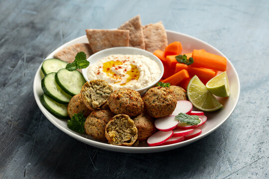 Falafel Plate Platter with hummus, vegetables and pita. Healthy food snack.