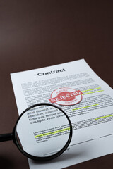 Close-up of a rejected contract under inspection. Concept of legal review, dispute resolution, and unsuccessful agreement.