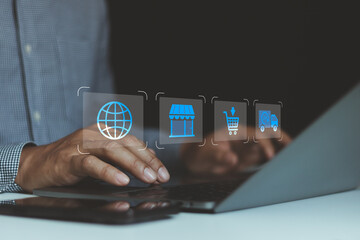 Businessman using laptop with ecommerce icons, online store, global shopping, digital marketplace, order processing, delivery service, supply chain for modern online business and internet retail.
