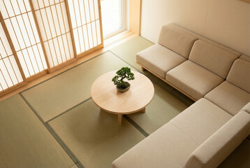 A modern living room designed in a minimalist style featuring a bonsai tree