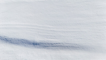 white fresh snow covered land ground from drone aerial photography background nobody