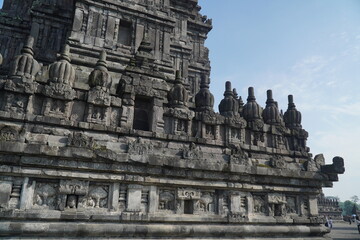 Fototapeta premium Detailed Stone Relief Carvings and Stupas on Prambanan Temple Wall