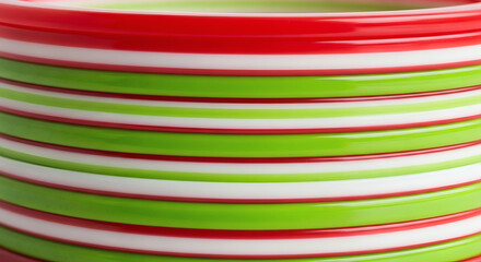 Colorful Plastic Plates Stacked in Alternating Red Green White