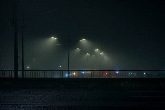 A winter city in the fog at nigth