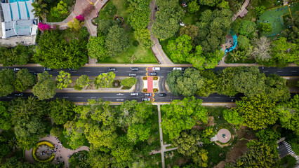 Top down drone photo of avenue crossing a large green urban park in Lima, Peru.