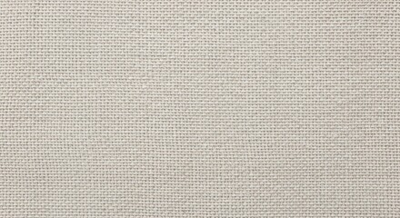 Fototapeta premium Neutral colored textile material displays a fine, uniform woven texture across the entire frame.