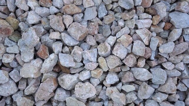 Crushed limestone, a material for road construction, close-up video.	
