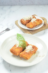 Fried durian is a unique Indonesian snack made from durian flesh wrapped in spring roll pastry.