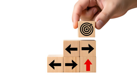 Hand placing target block on directional wooden blocks for strategy planning, isolated on transparent background