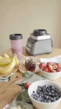 Smoothie Ingredients with Blender, Bananas, Berries, and Honey