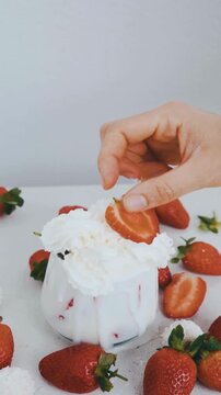 Fresh Strawberry Slice on Top of Whipped Cream Dessert in Glass