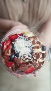 Healthy Acai Bowl with Strawberries, Blueberries, Bananas and Chocolate Drizzle