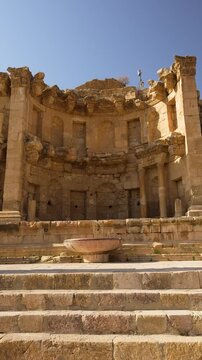 Ruins of the Nymphaeum in the ancient Roman city of Jerash, Jordan vertical video landmark