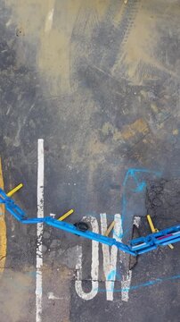 Vertical Drone rise over road barriers, pothole and low bridge warning