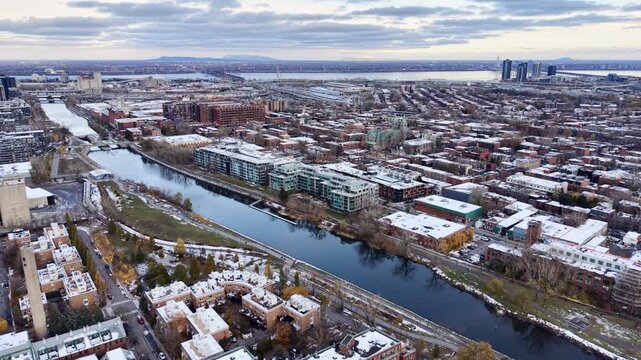 defaultAerial view of Griffintown Montreal and Lachine Canal with winter cityscape and river at daytime. g.