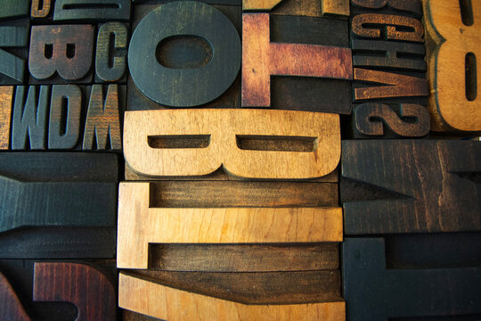 closeup shot of a mixed set of vintage wooden letterpress blocks

