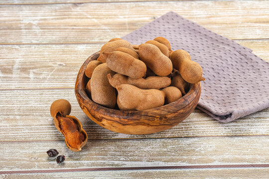 Tropical exotic Tamarind fruit heap