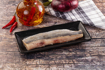 Fototapeta premium Marinated pickled salted herring fillet