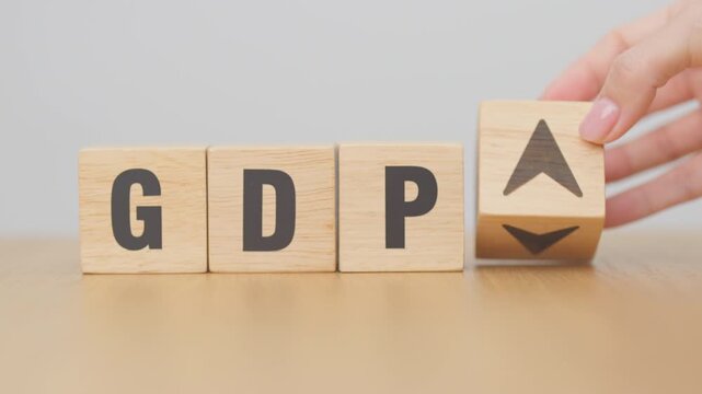 hand change wooden block with GDP text to UP and Down arrow symbol icon. Gross domestic product, Financial, Management, Economic growth, consumption, investment, government purchases and net exports