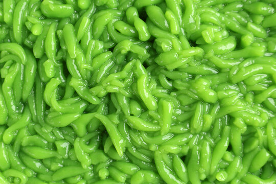 Texture of Homemade Cendol Dawet, WOrm Like Green Jelly Made from Rice Flour.