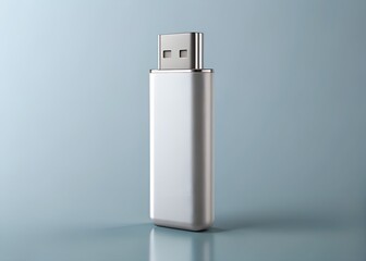 Usb drive standing upright on a reflective blue surface isolated