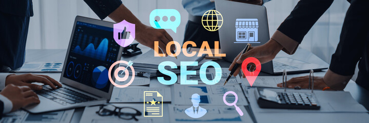 A professional team collaborates on local SEO strategy in a modern office, featuring laptops,...