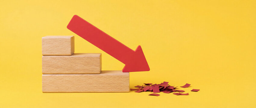Business Decline Concept with Red Arrow and Wooden Stair Blocks on Yellow Background