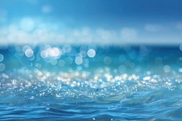 A serene water surface shimmering with sunlight, creating a tranquil blue background filled with soft bokeh effects.
